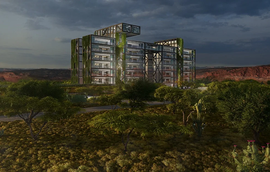 Modular luxury living structure surrounded by desert landscape, featuring green accents, designed for mobile and relocatable living solutions by ARC Development.